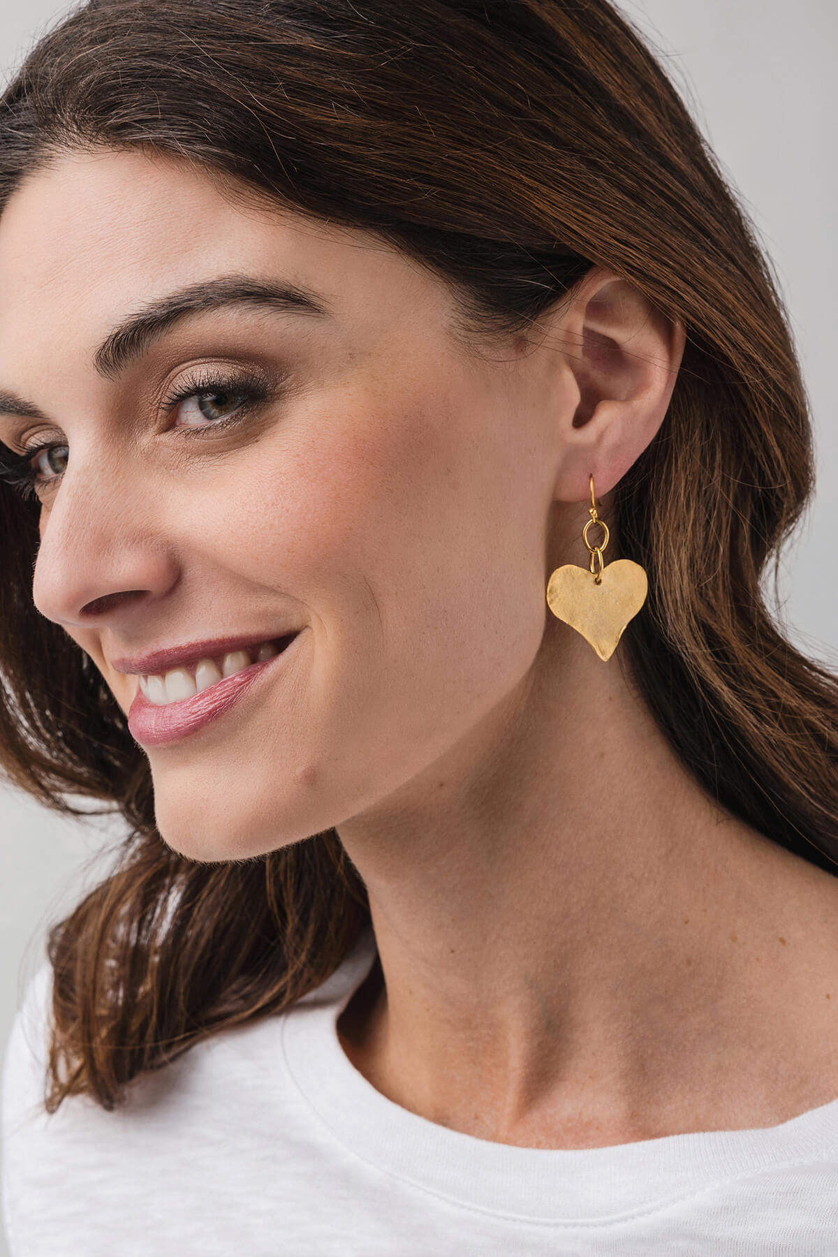 Susan Shaw gold heart drop earrings with textured heart charms