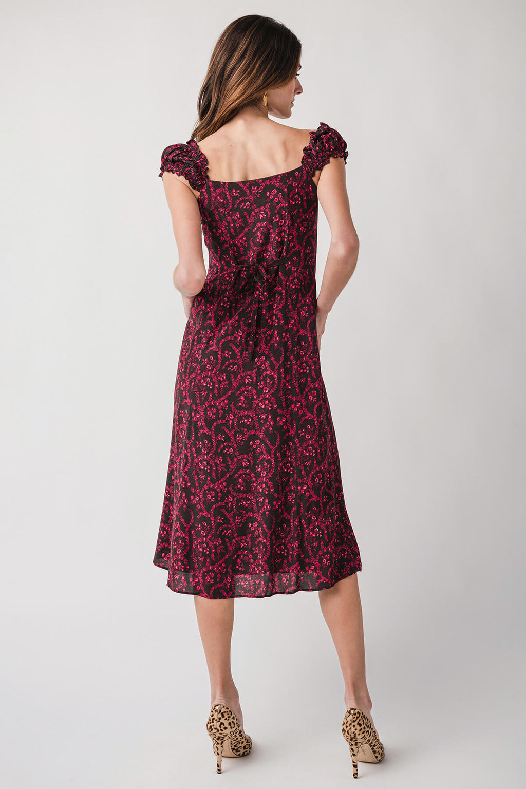 Back view red patterned midi dress, square neckline and gathered shoulder details