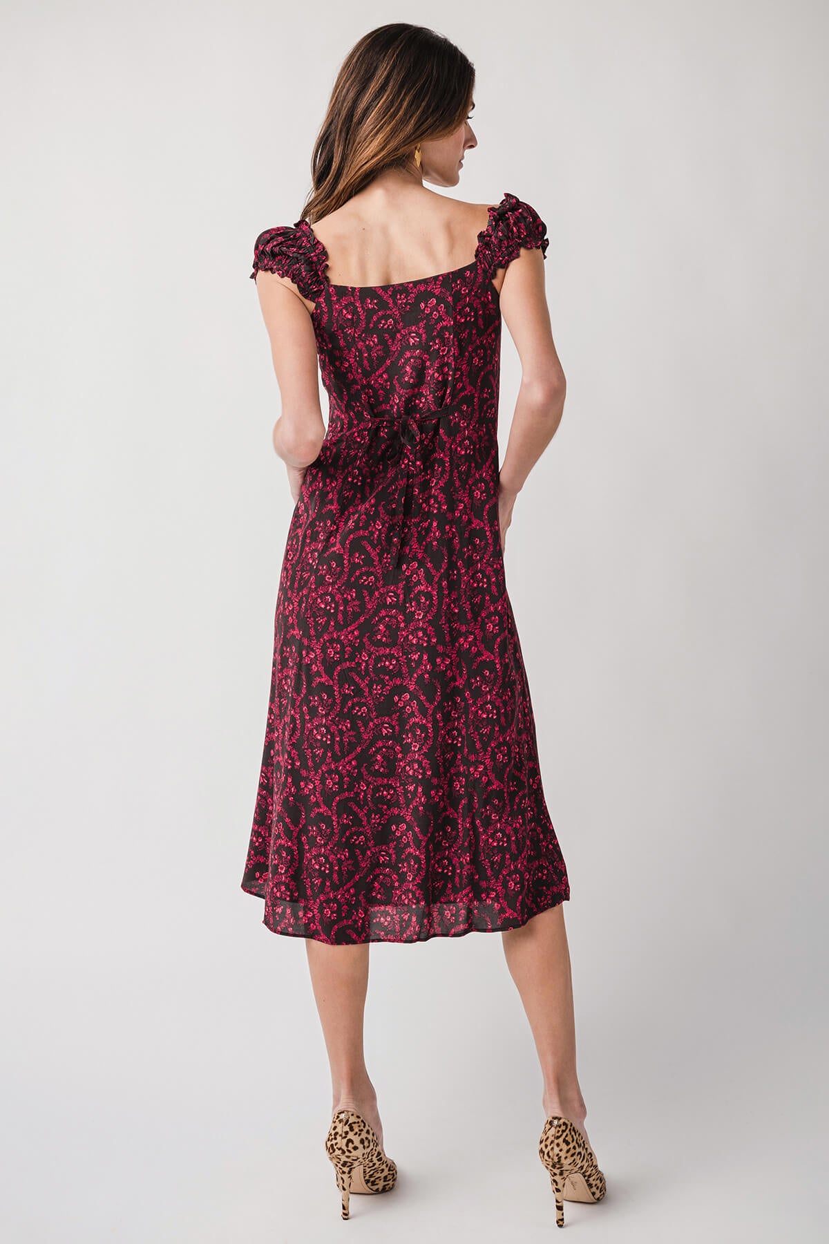 Back view red patterned midi dress, square neckline and gathered shoulder details