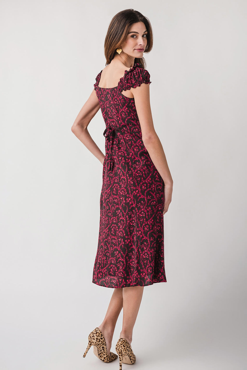 Red patterned midi dress with off-shoulder neckline and short puff sleeves