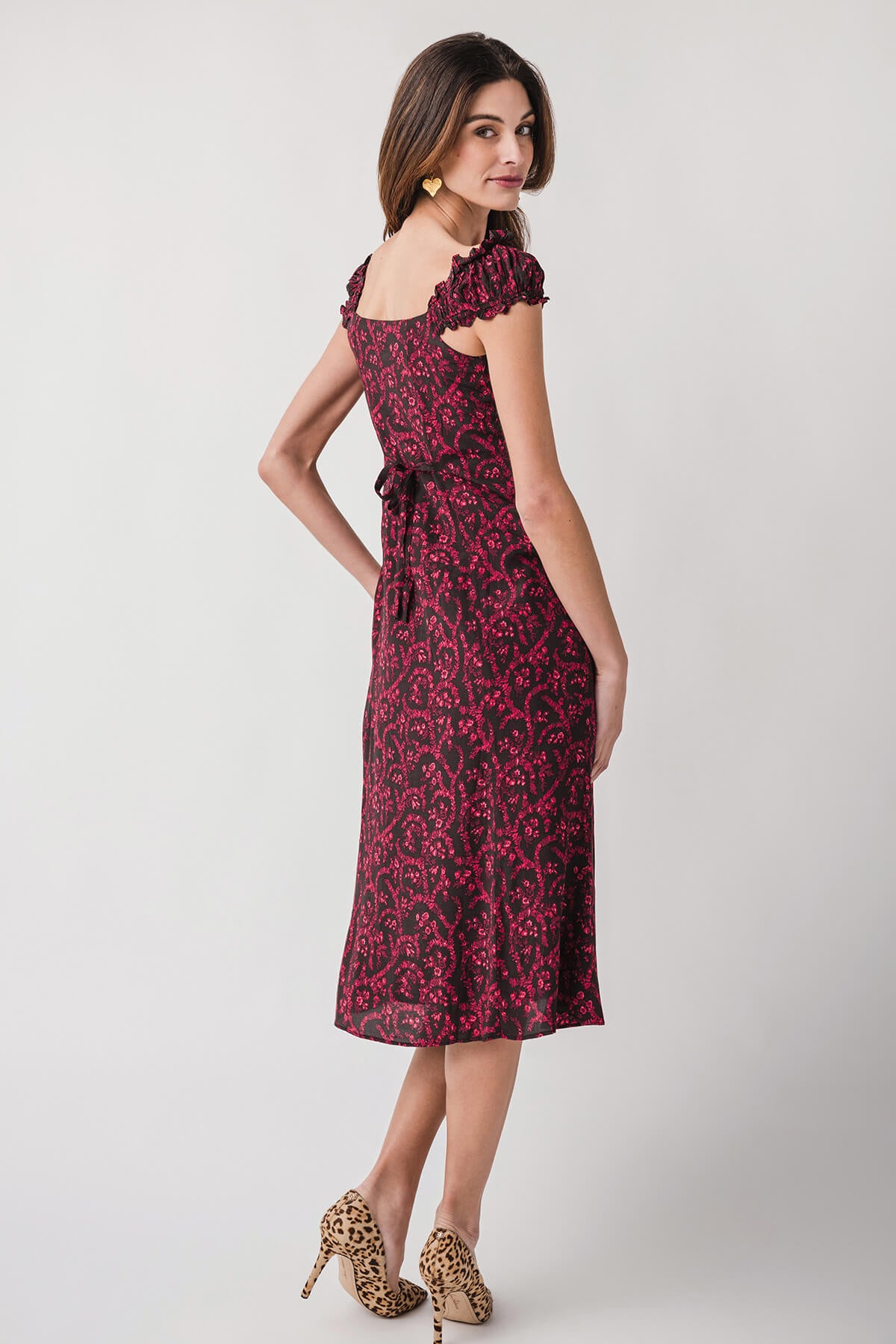 Red patterned midi dress with off-shoulder neckline and short puff sleeves