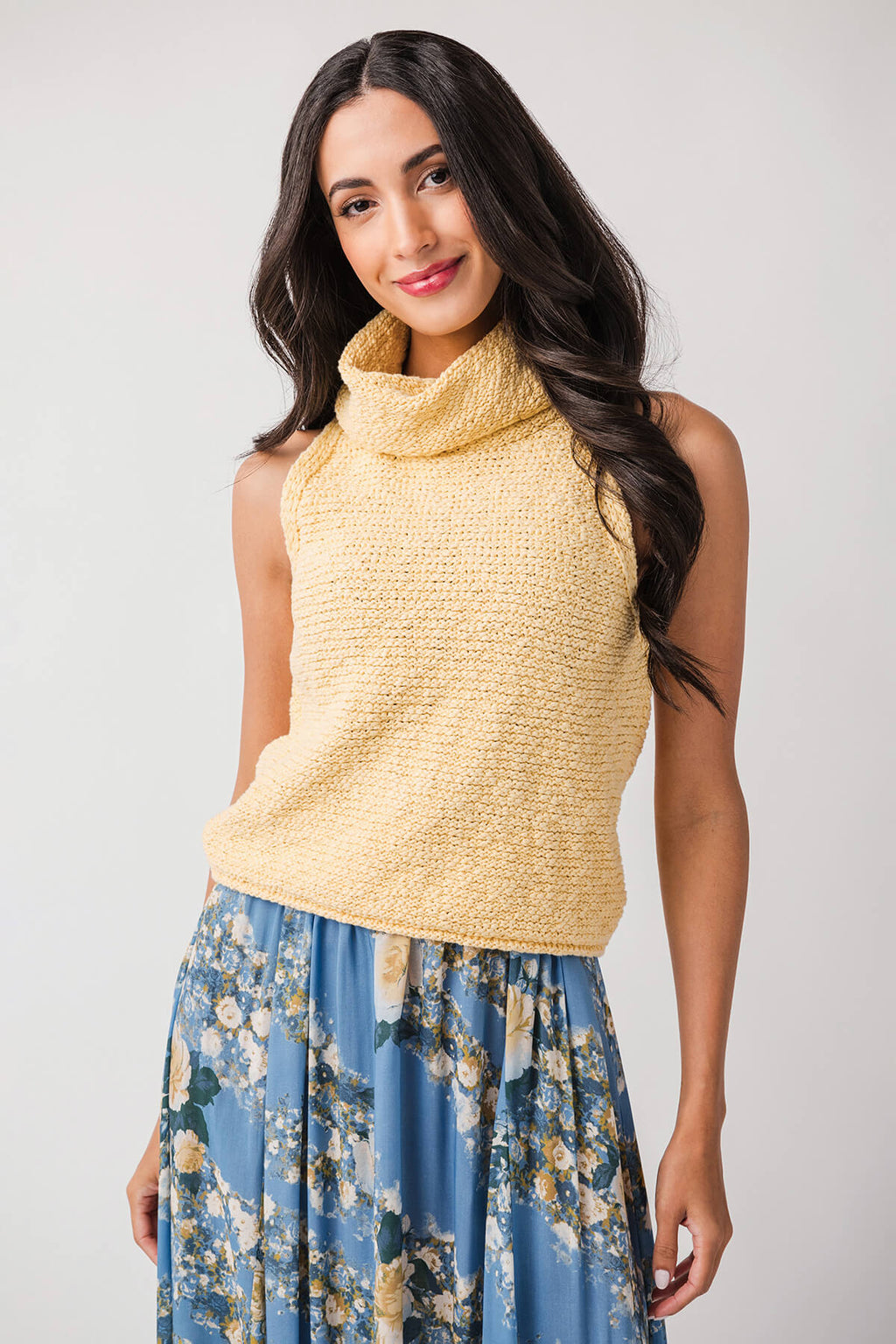 Warm yellow sleeveless knit top with draped cowl neckline and textured weave