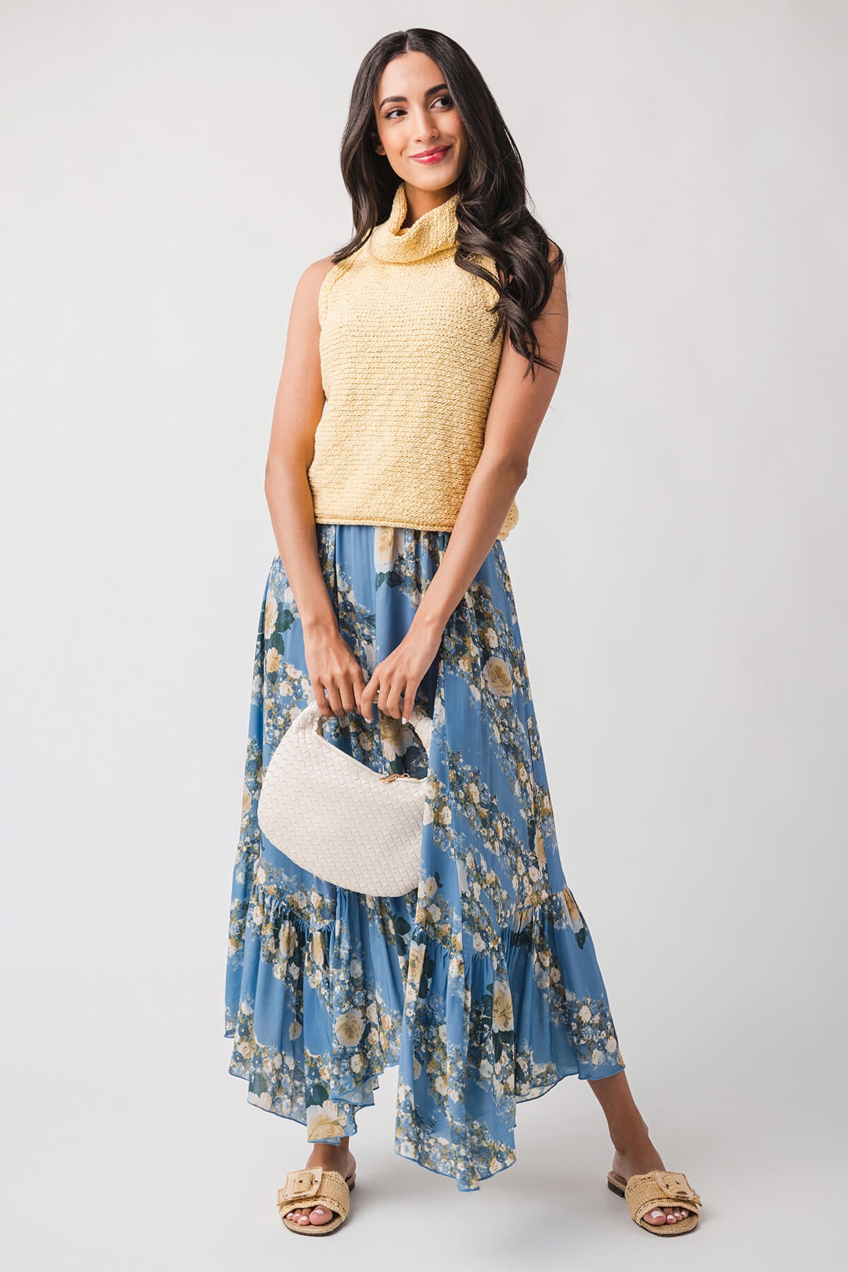 Warm yellow sleeveless knit top with high cowl neck and straight hem