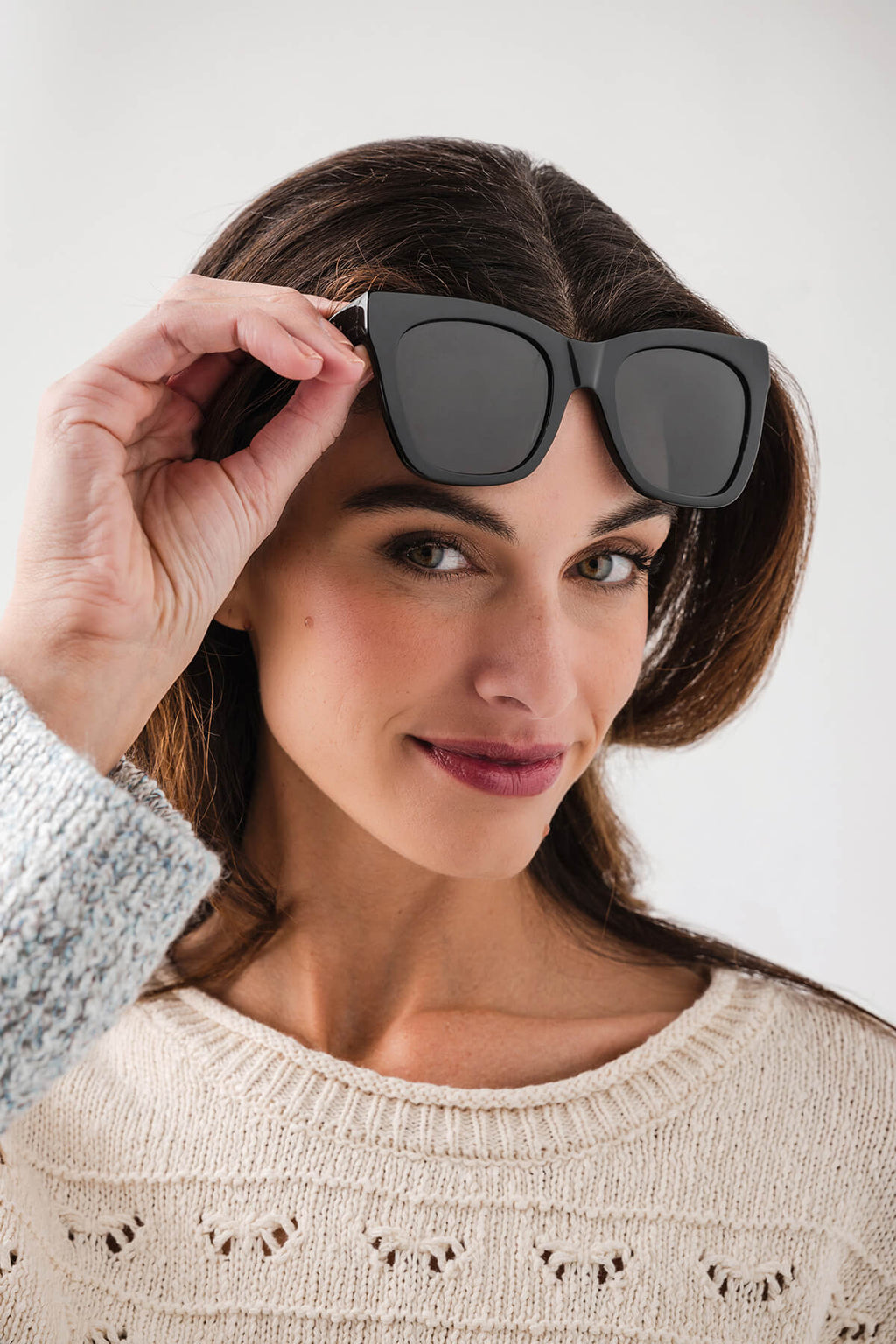 Black polarized sunglasses with dark lenses, rounded square frames