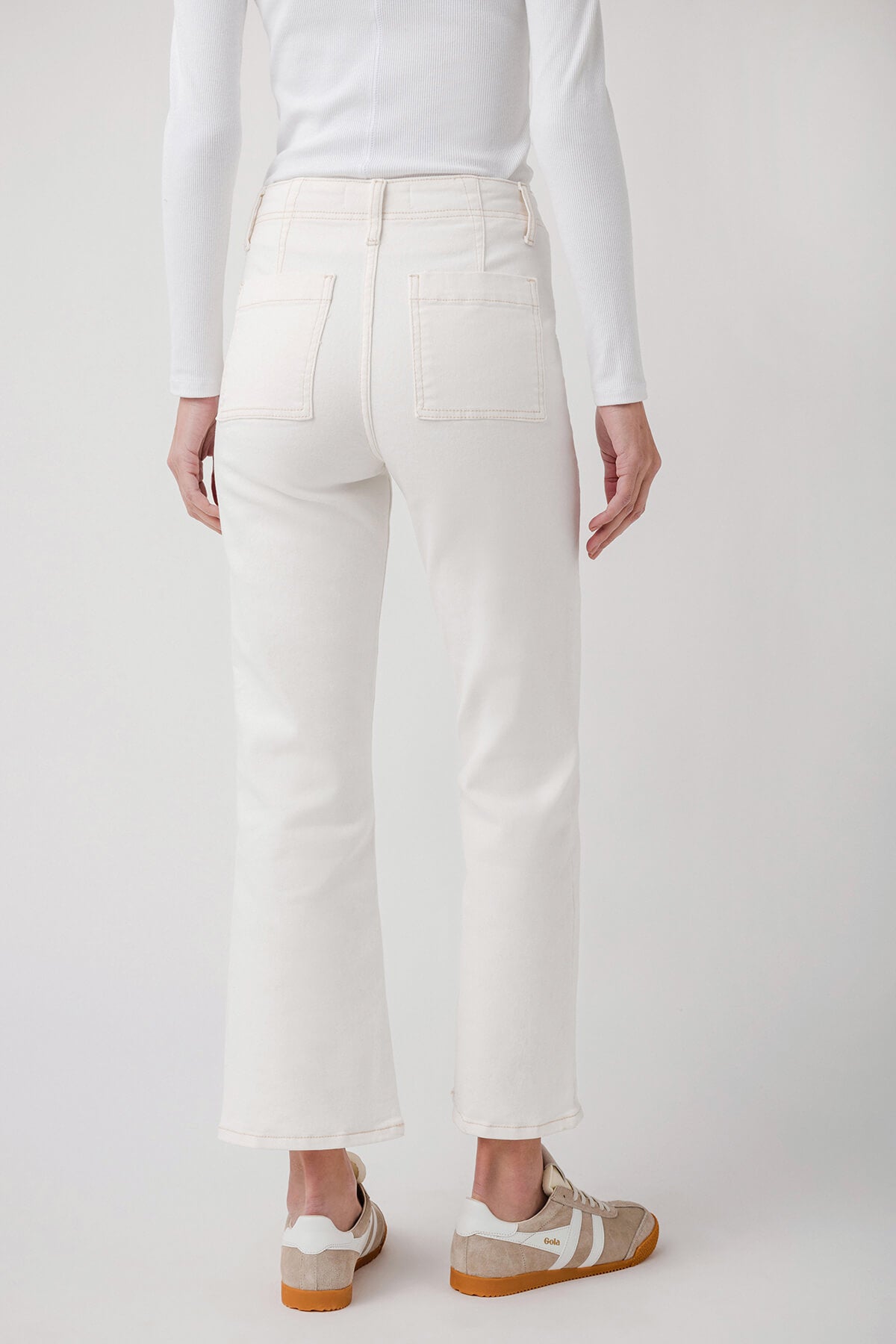Cream ankle flare jeans with button closure, straight yoke and front pockets