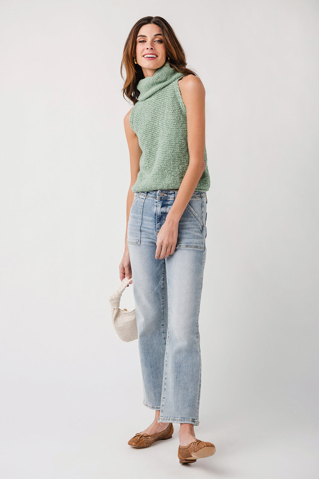 Green sleeveless high-neck knit top, close fit with textured sleeveless body