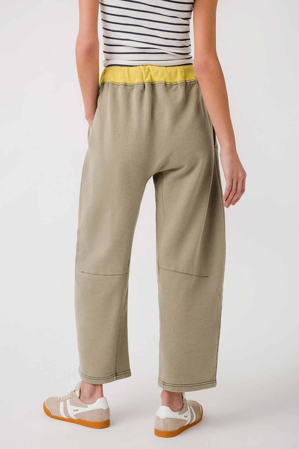 Sage green cropped pants with elastic waistband, drawstring, and side pockets