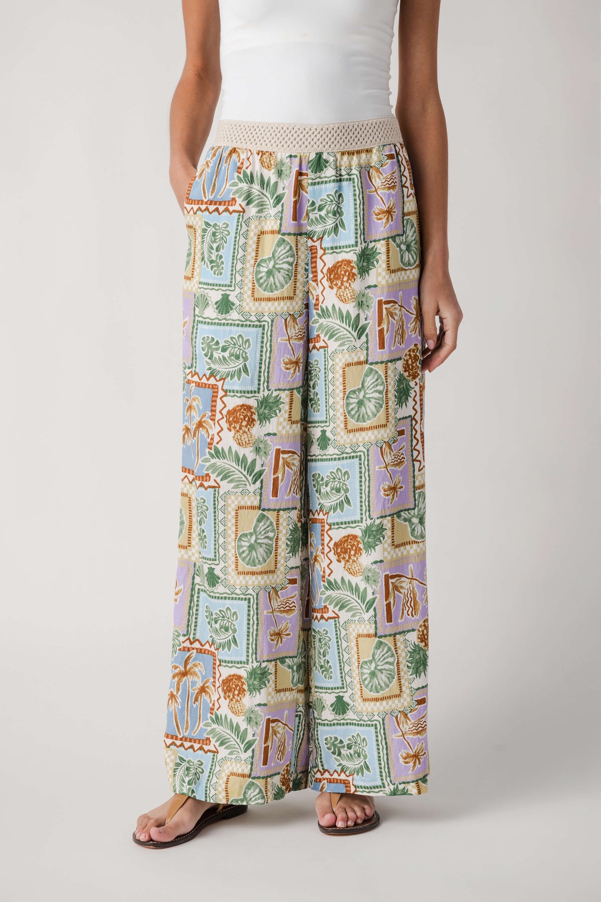 Wide-leg printed pants with colorful patch design and elastic waist, straight-on view