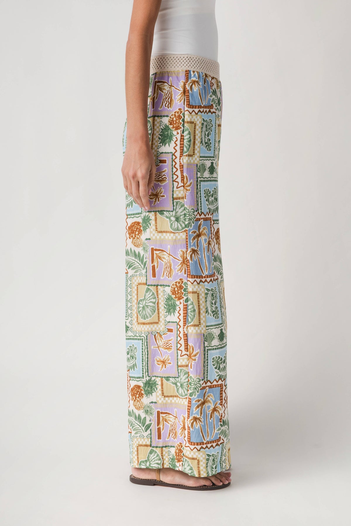 Full-length wide-leg pants with colorful rectangular patch print, side view