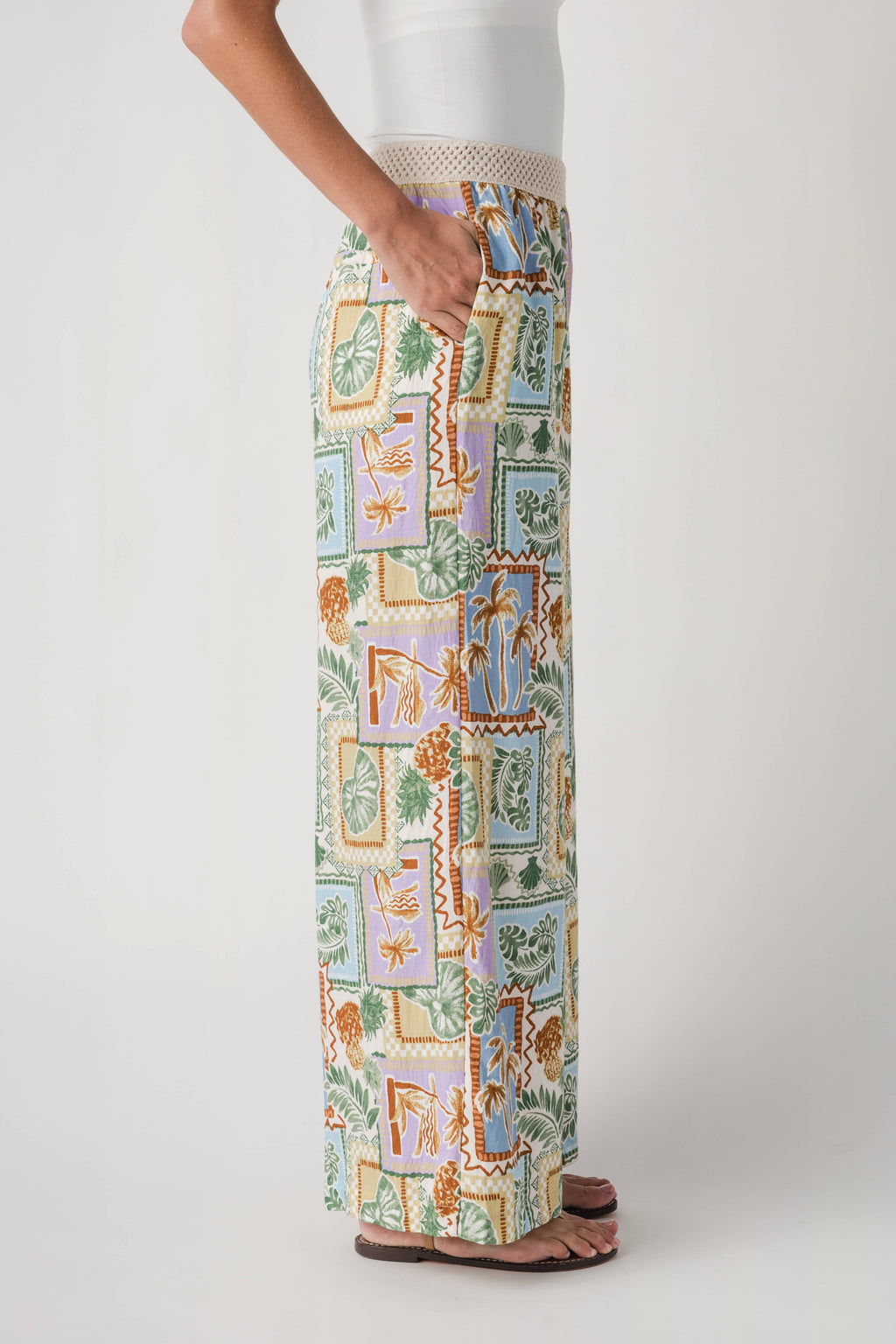 Wide-leg patch-printed pants with elastic waist, front leg view on model