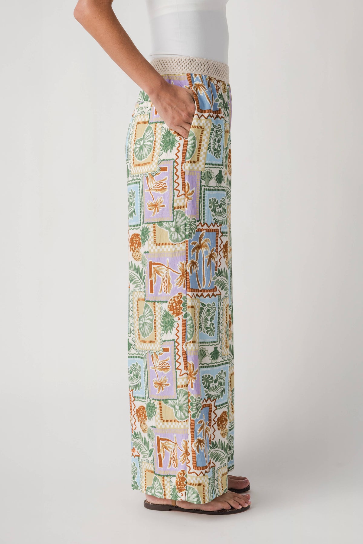Wide-leg patch-printed pants with elastic waist, front leg view on model