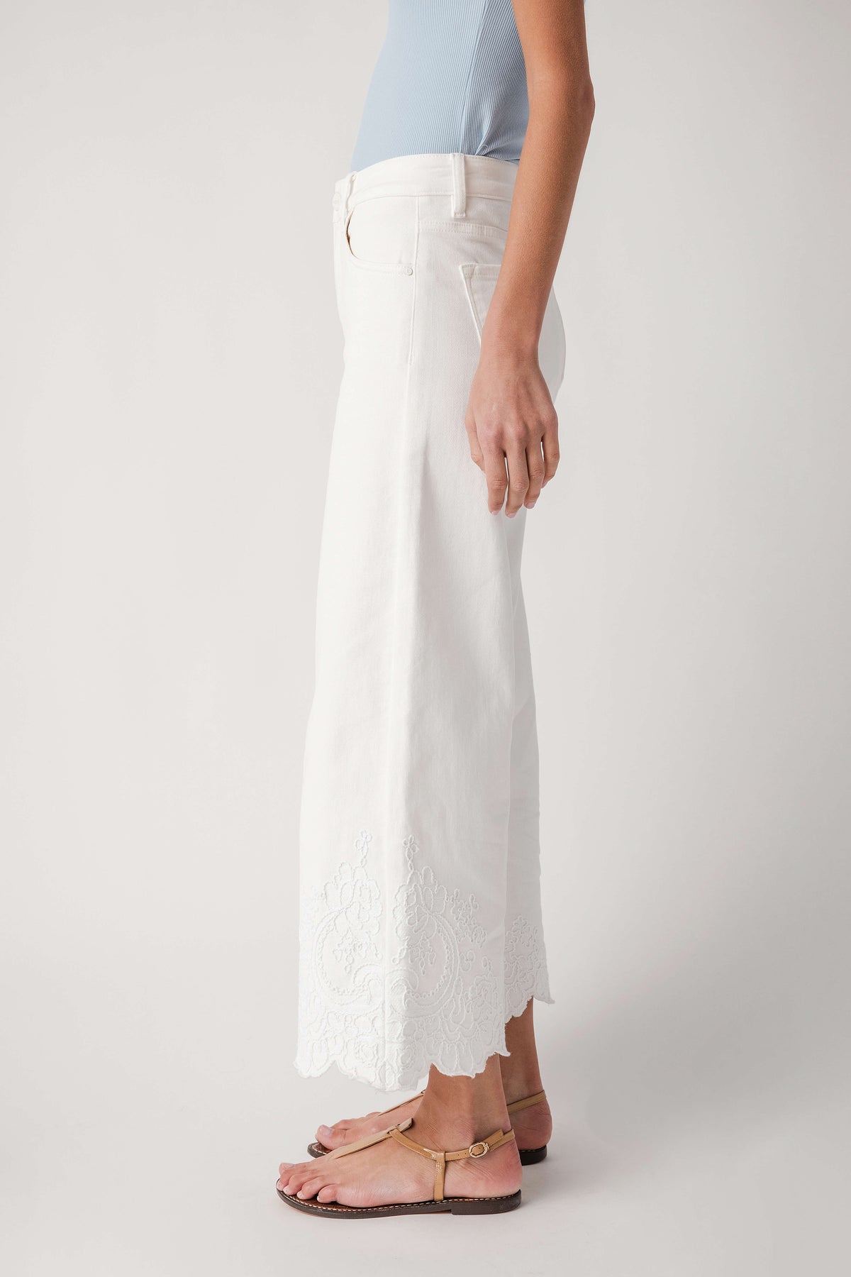 Cream high-rise crop wide-leg pants with scalloped lace trim hem