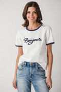 White Bonjour T-shirt with navy collar and sleeve trim, worn with blue jeans