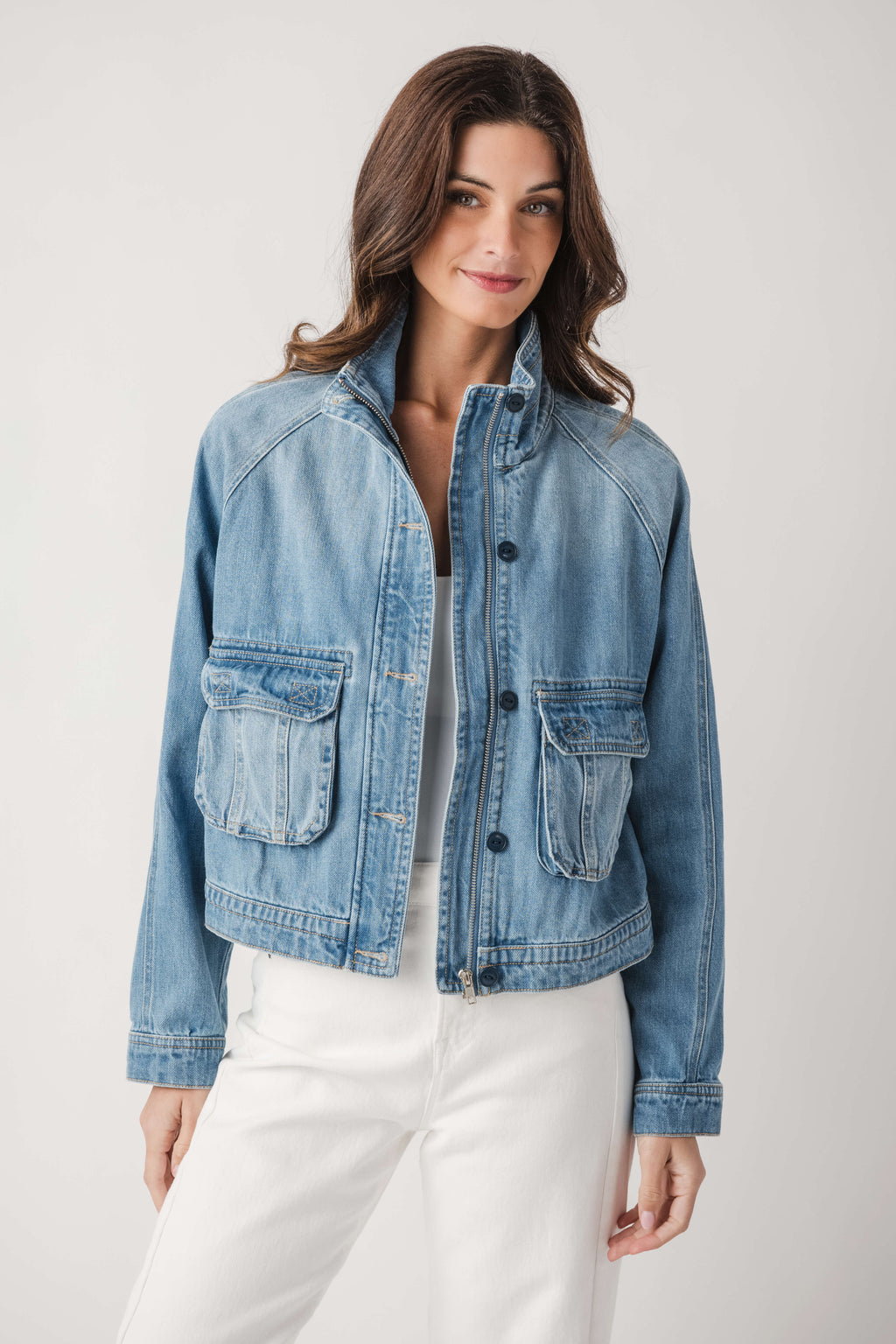 Light blue denim jacket with button-front closure and chest flap pockets