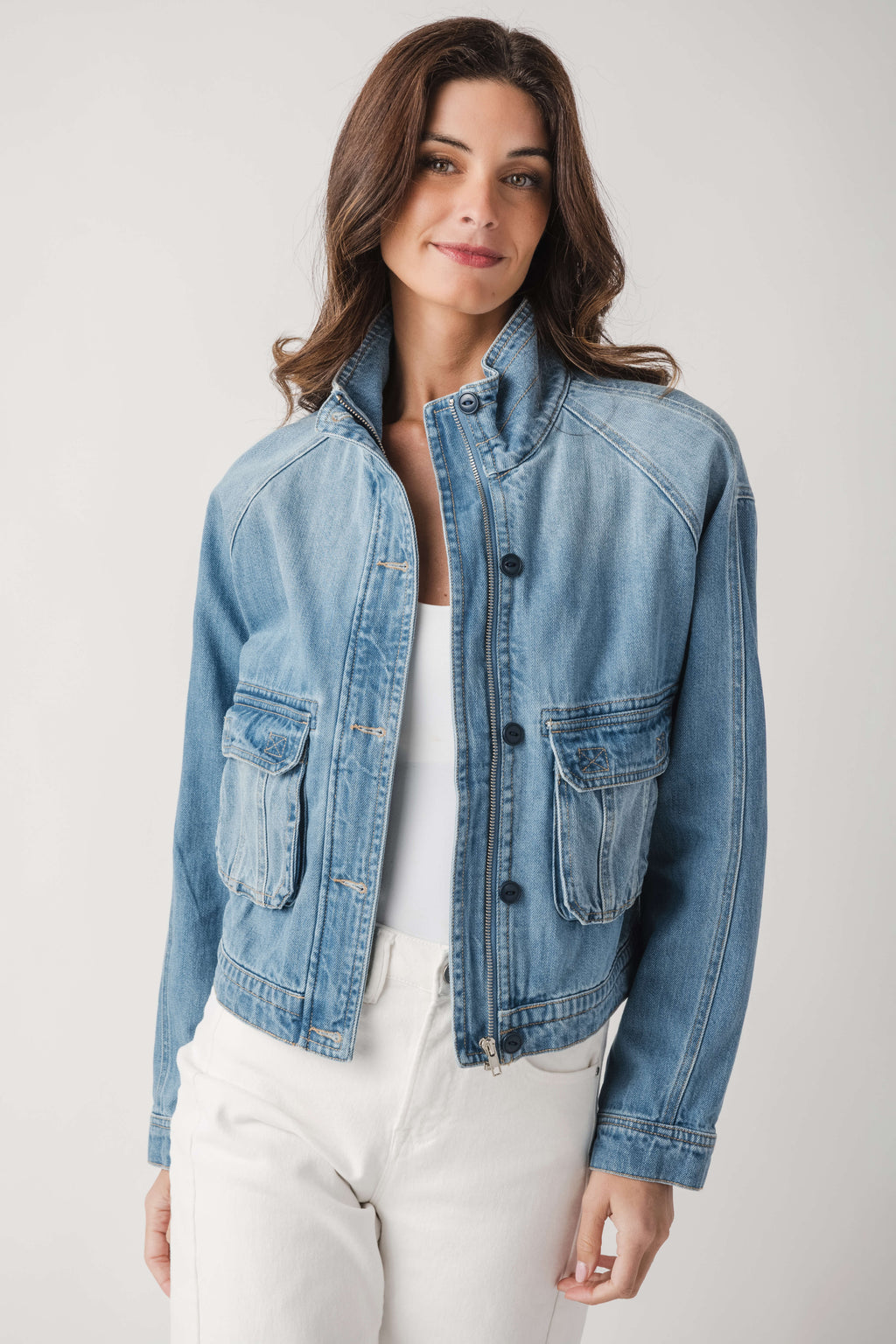 Light blue denim jacket with flap chest pockets and button-front placket