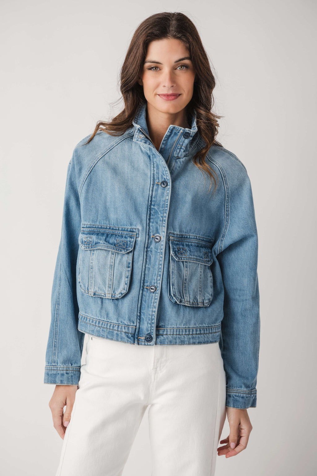Light blue denim jacket with two chest flap pockets and button-front closure