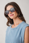 Brown tortoise sunglasses with dark lenses, wide square frames