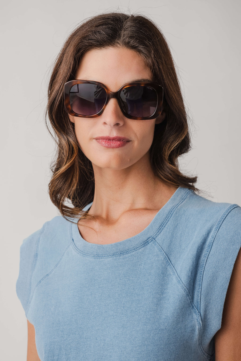 Brown tortoise square sunglasses with dark lenses, full-frame design
