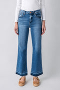 Medium blue high-rise straight jeans, back view, released hem detailing at ankle