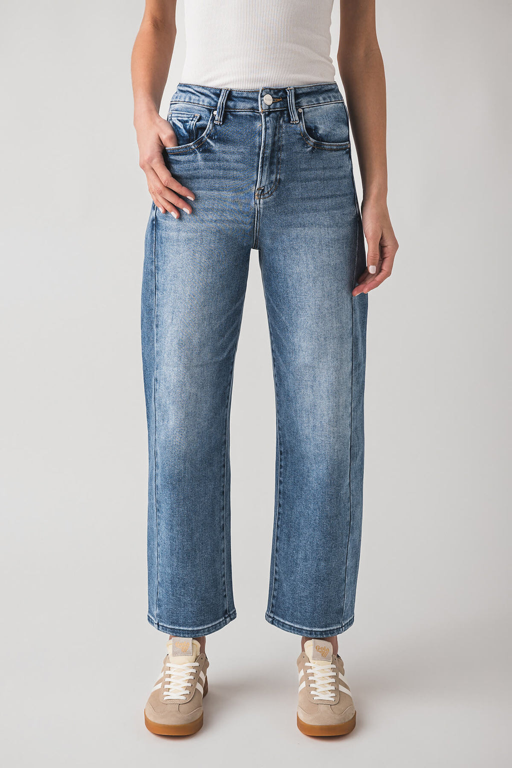 High-rise barrel jeans in medium blue wash with front pockets and relaxed barrel leg