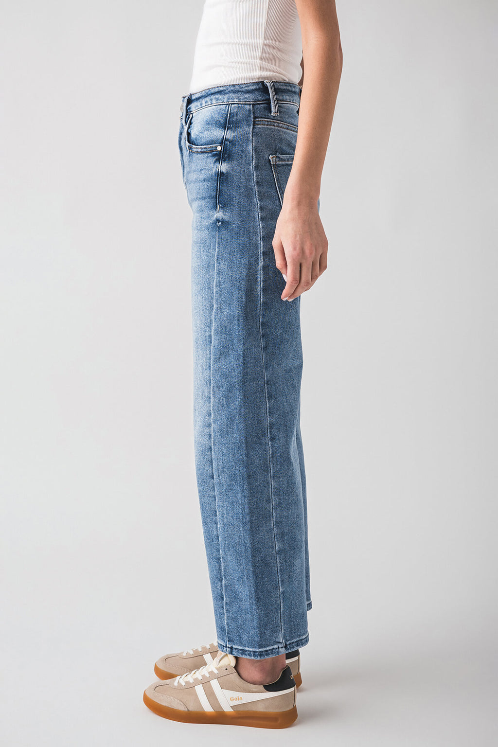 High-rise barrel jeans in medium wash blue, straight wide leg with button/zip fly