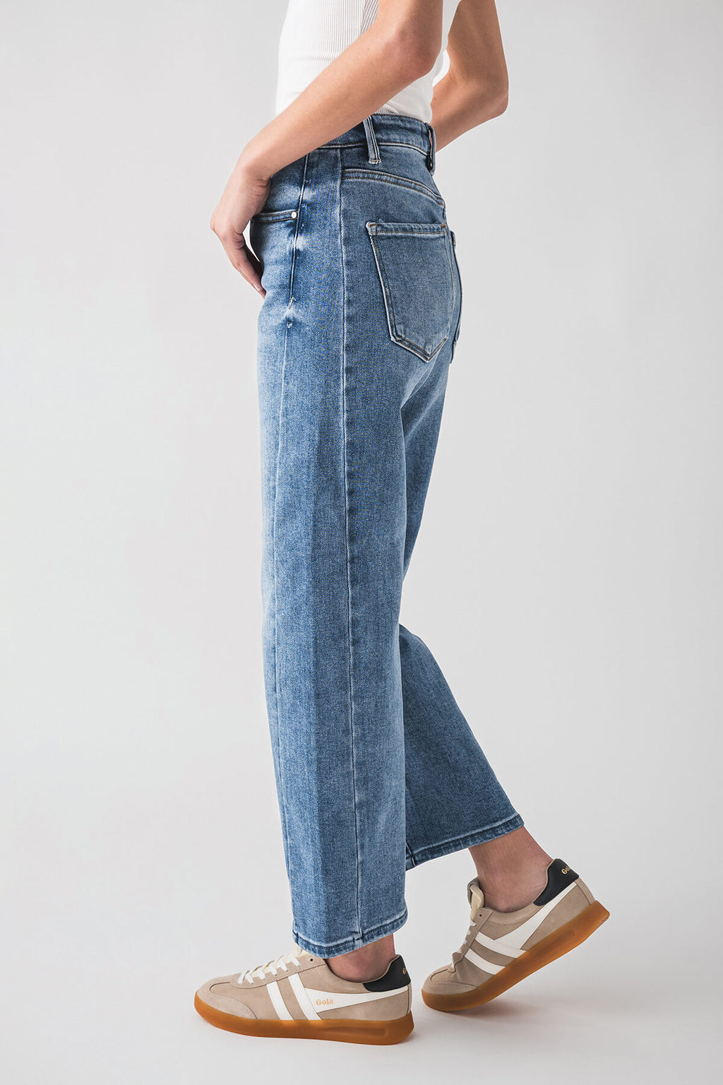 High-rise barrel jeans in medium blue denim with side slant pocket and wide leg opening