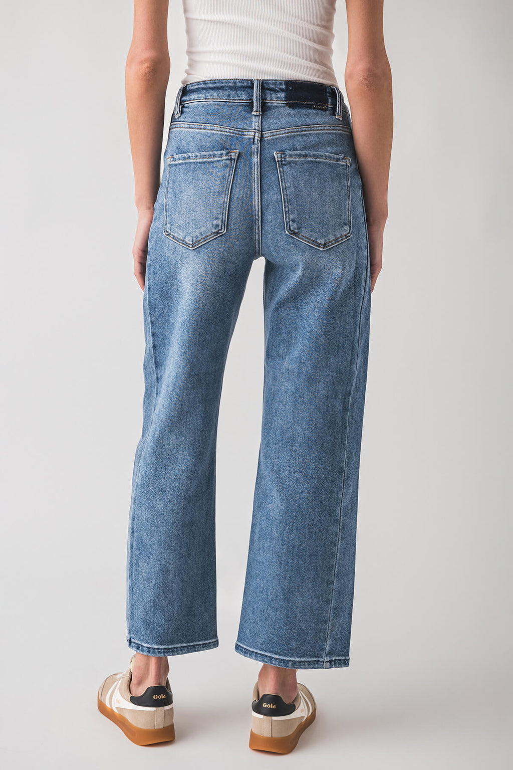 High-rise barrel jeans in medium blue wash with back patch pockets and straight legs