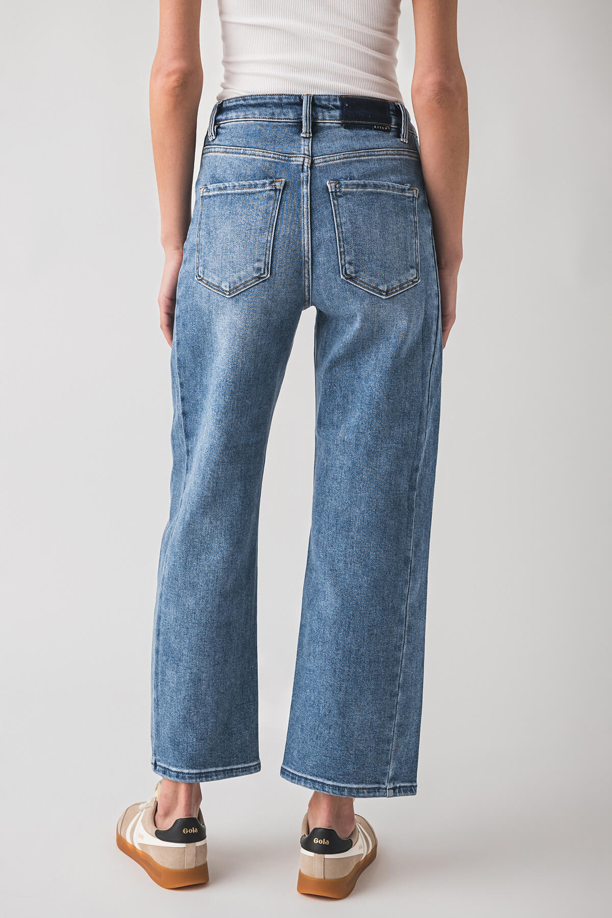 High-rise barrel jeans in medium blue wash with back patch pockets and straight legs