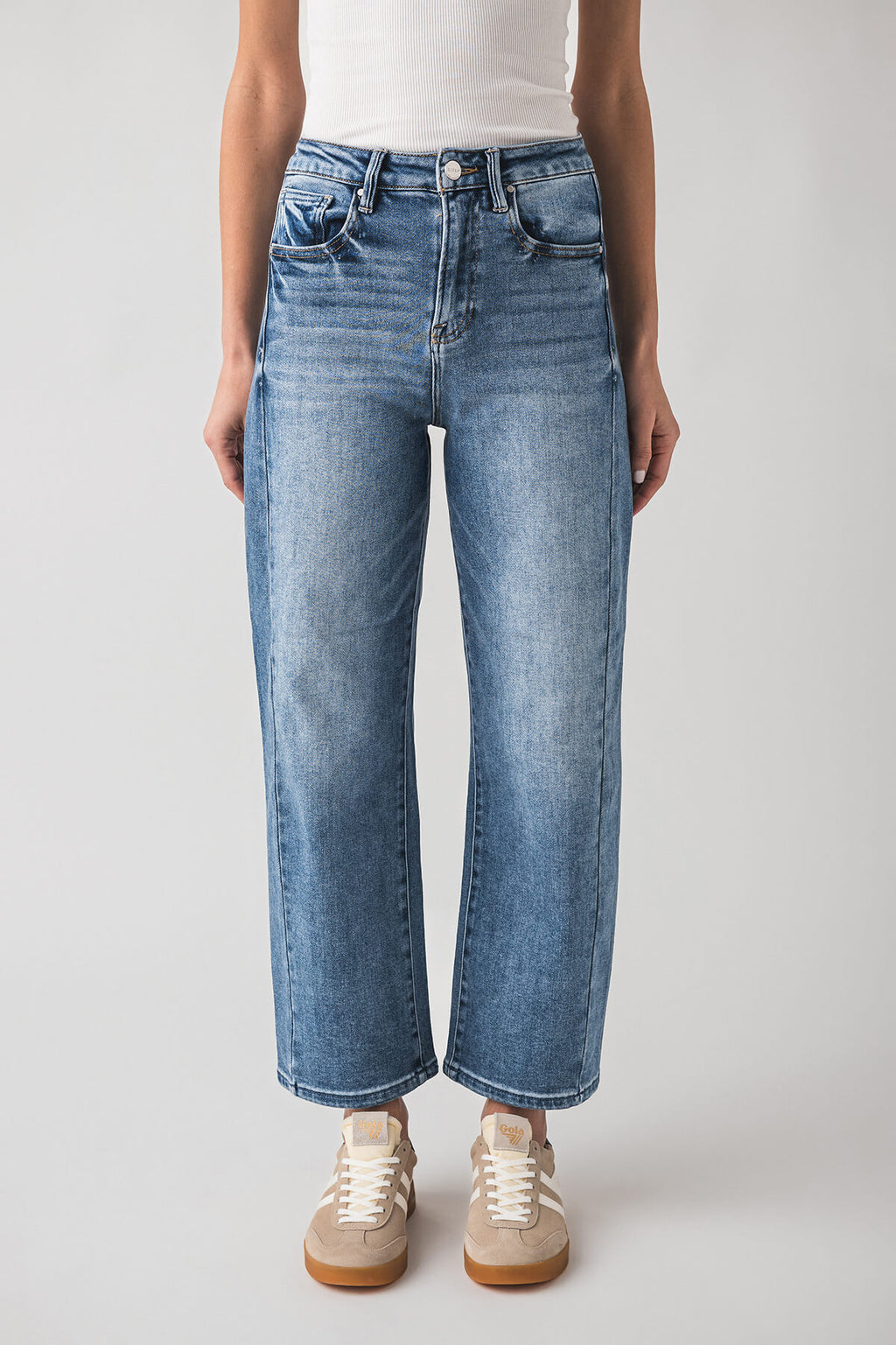 High-rise barrel jeans in blue wash with button-and-zip fly and wide barrel silhouette