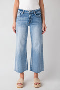 High-rise wide-leg light wash denim jeans with button fly and back yoke