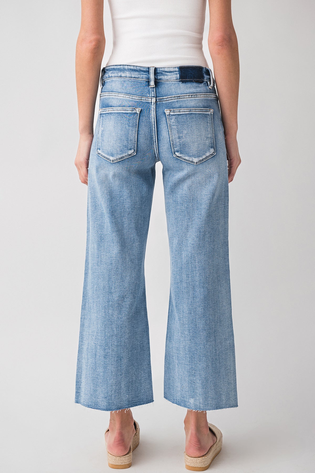 High-rise wide-leg light wash denim jeans with belt loops and front pockets