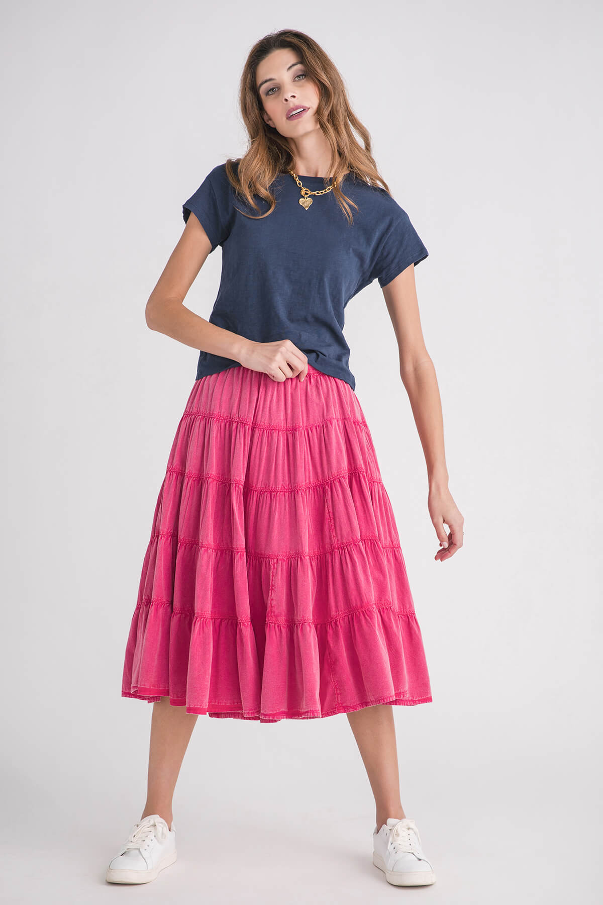 Navy modern slub tee with short sleeves and round neckline, paired with a pink tiered skirt