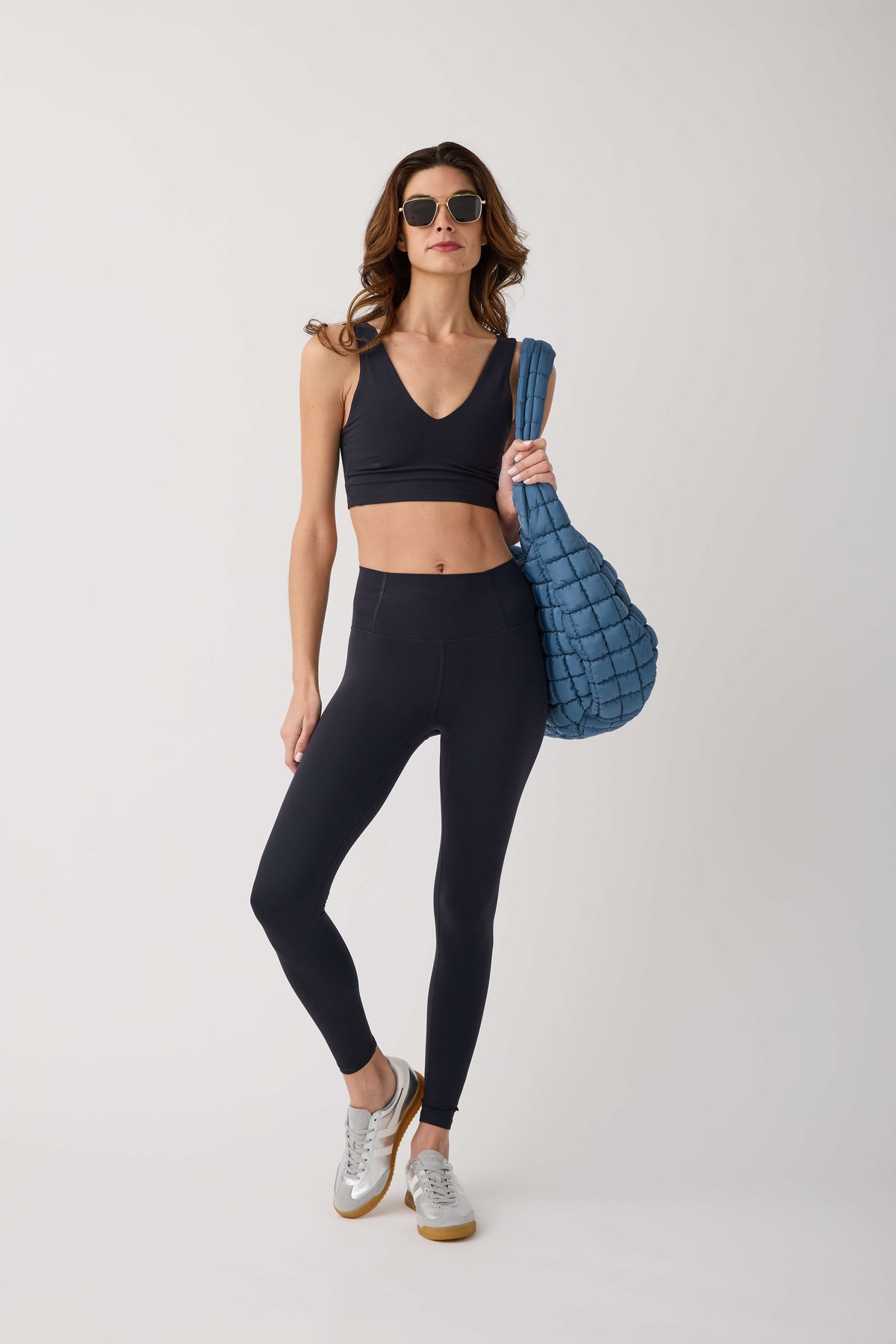 Black high-waist leggings, ankle length, sleek fitted look