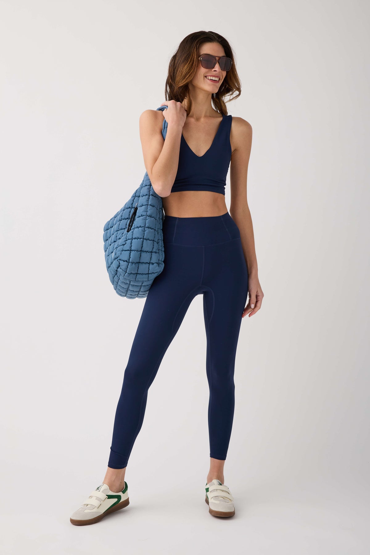 Dark navy V-neck crop cami sports bra with racerback, cropped hem and logo detail