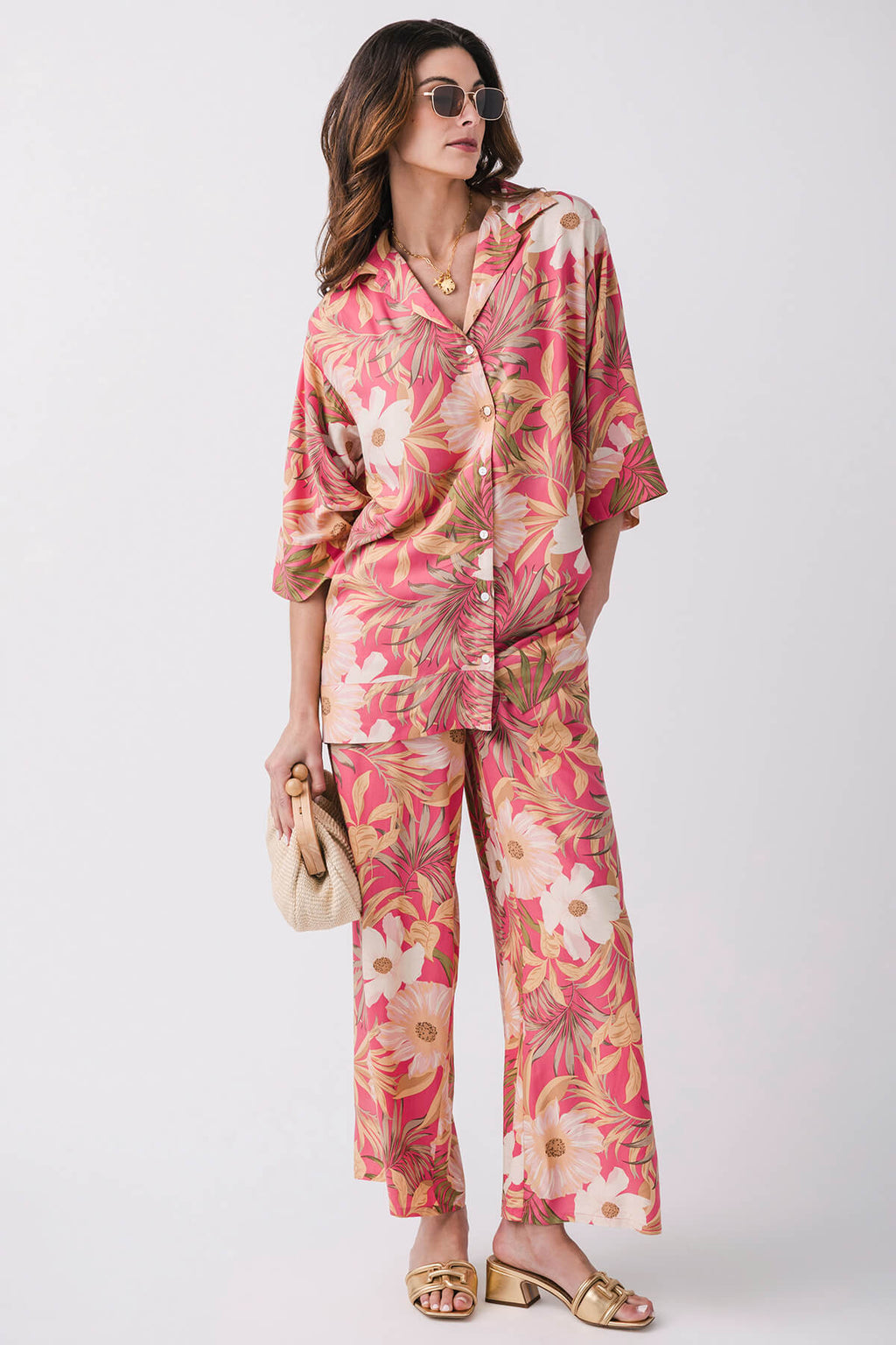 Pink tropical floral pants with elastic waistband and relaxed straight legs