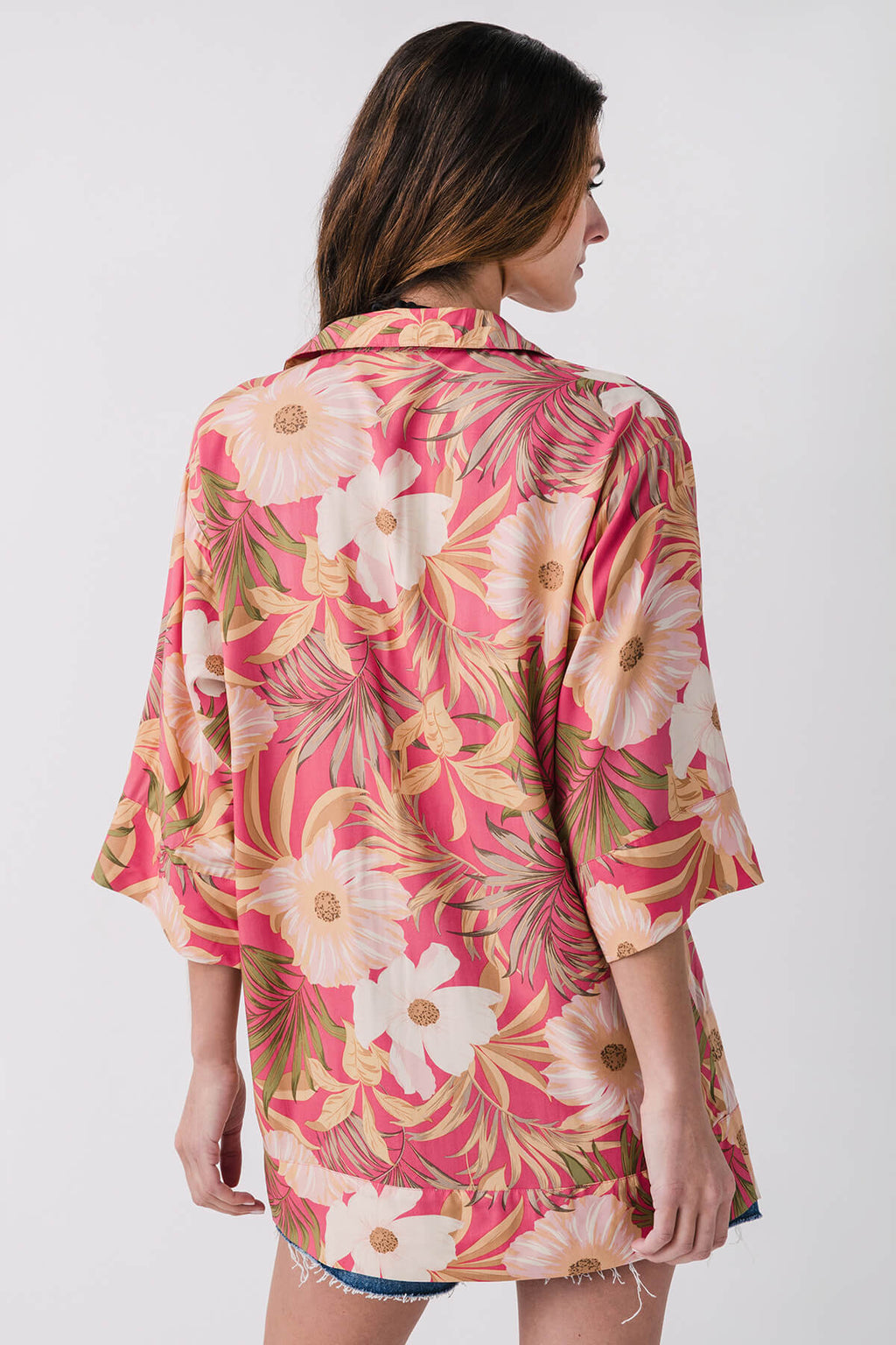 Back view pink tropical floral mini dress with button details and 3/4 sleeves