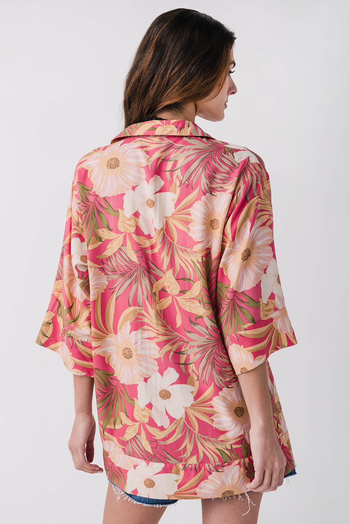 Back view pink tropical floral mini dress with button details and 3/4 sleeves