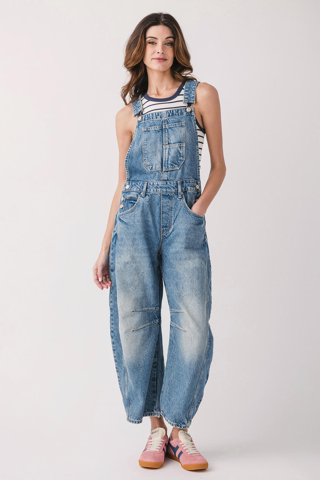 Light blue denim overalls with front pocket bib, relaxed fit and cuffed hems.