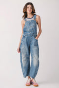 Light blue denim overalls with front pocket bib, relaxed fit and cuffed hems.