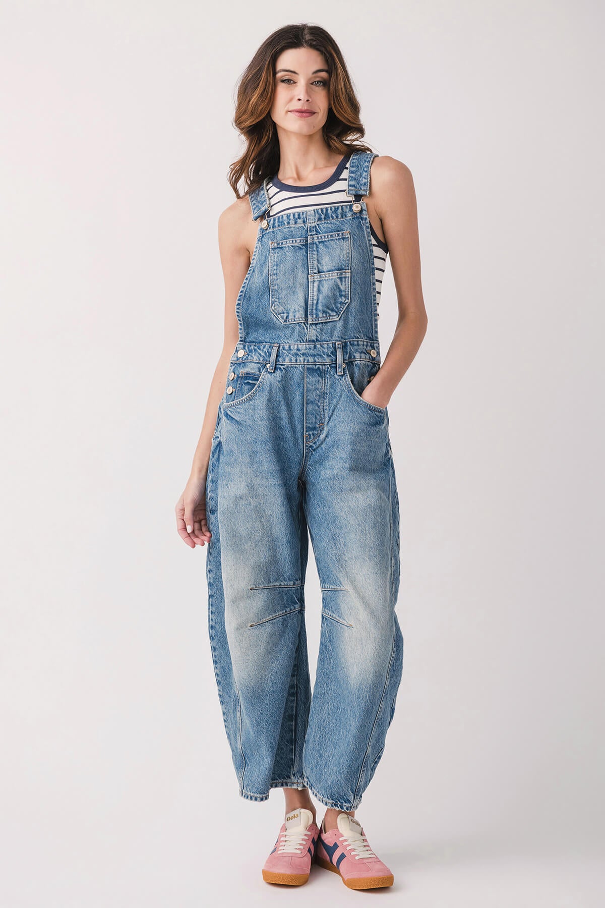 Light blue denim overalls with front pocket bib, relaxed fit and cuffed hems.