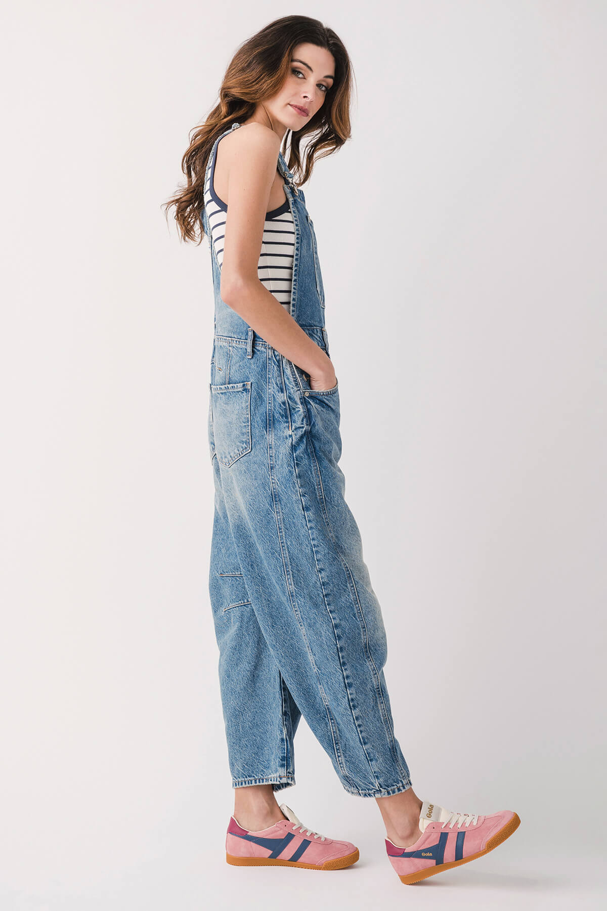 Light blue denim overalls with bib front and adjustable shoulder straps, full length.