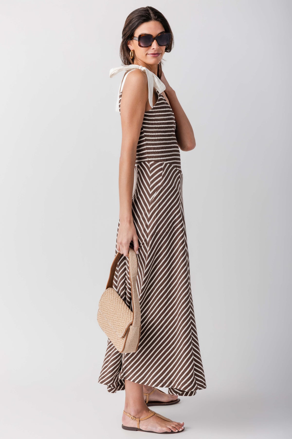 Sleeveless V-neck striped midi dress with flared skirt, side view
