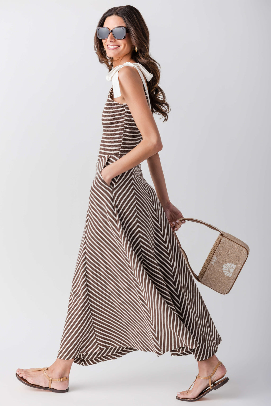 Sleeveless V-neck striped midi dress with flared skirt and chevron-pattern waist panel