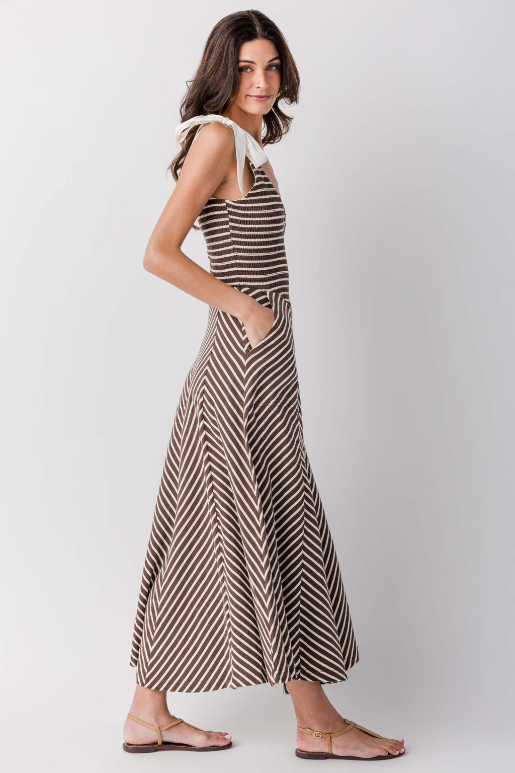 Sleeveless V-neck striped midi dress with flared skirt, angled side view