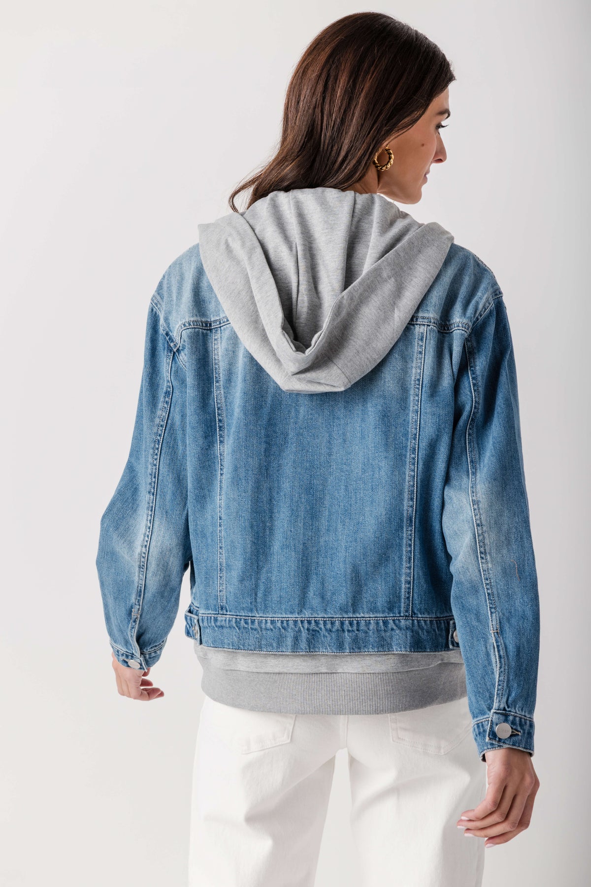 Blue denim sweatshirt jacket with gray hood, rear view with ribbed cuffs and hem