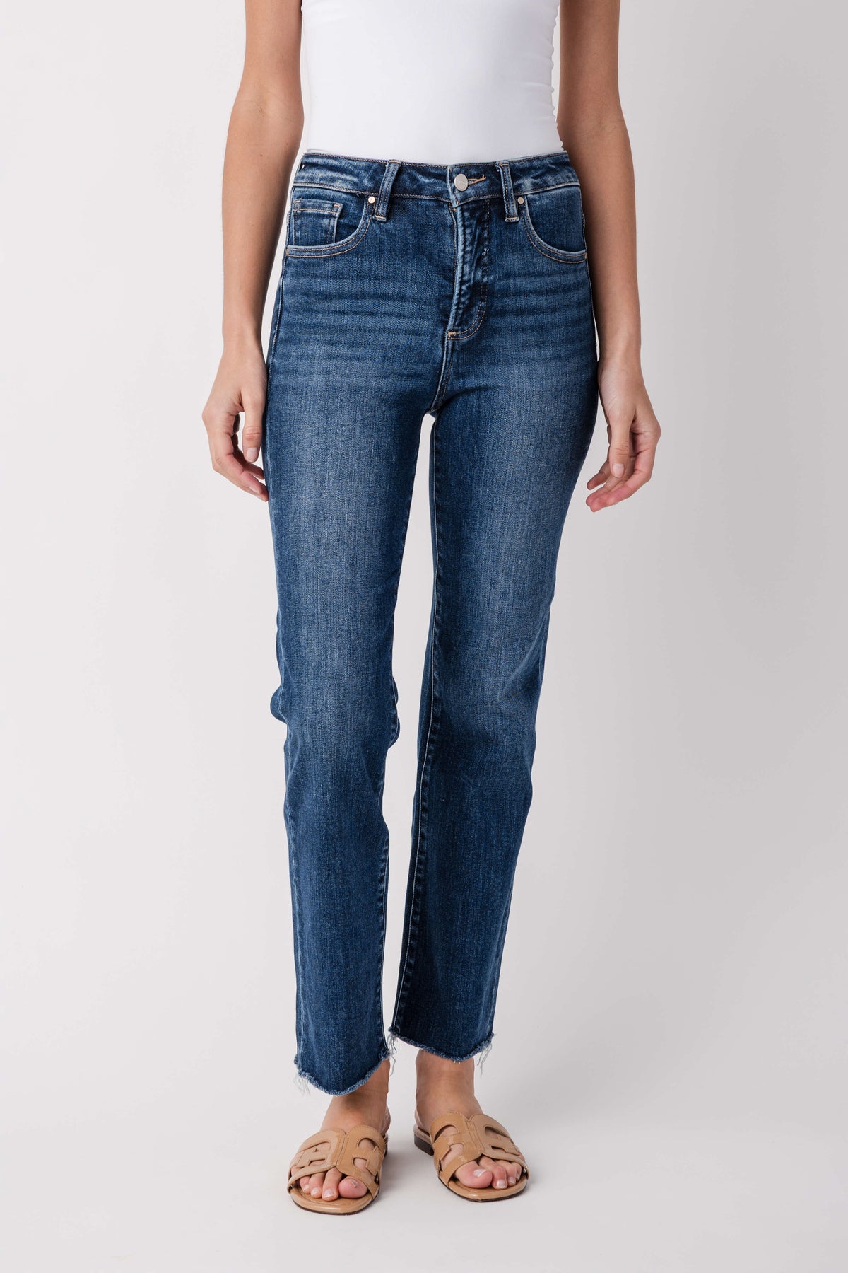 Dark blue high-rise crop straight jeans front view, zip fly, belt loops, frayed hem
