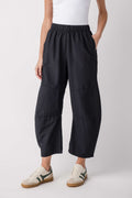 Black relaxed cropped pants with elastic waistband and cargo-style side pockets.