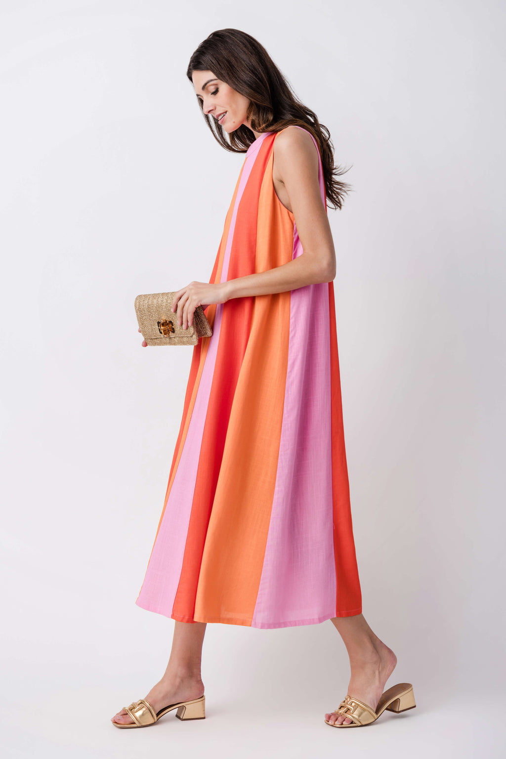 Sleeveless colorblock midi dress with vertical orange, pink, and lilac panels, side view.
