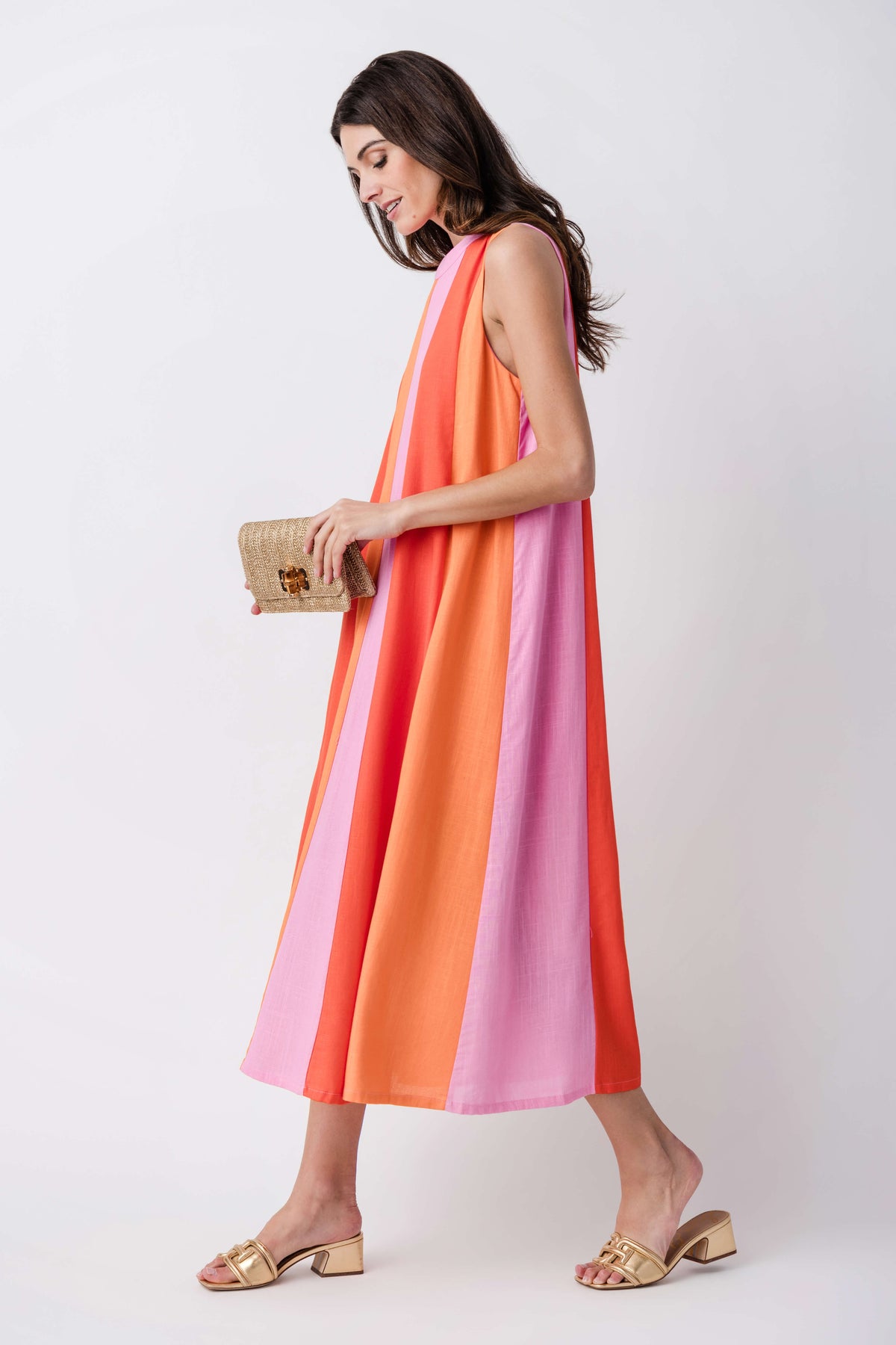 Sleeveless colorblock midi dress with vertical orange, pink, and lilac panels, side view.