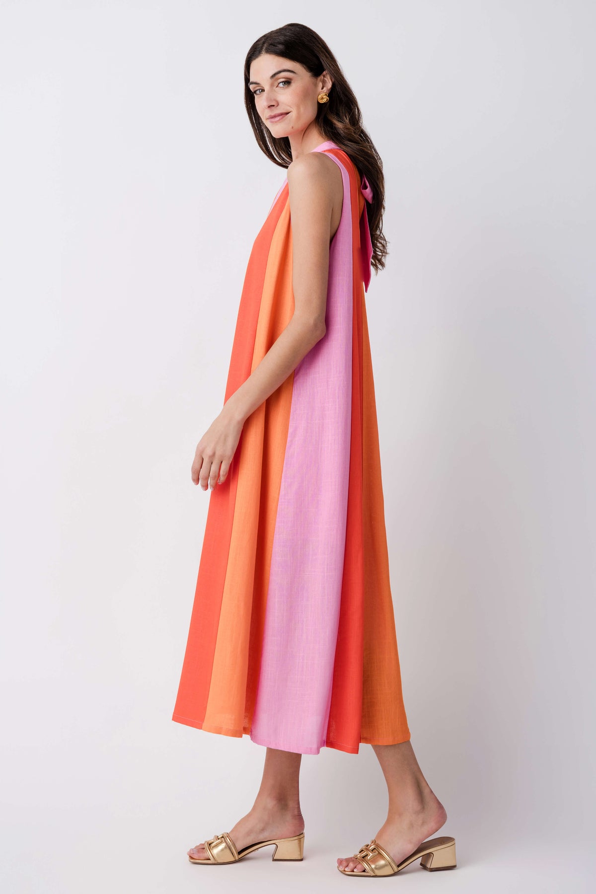 Sleeveless colorblock midi dress with V-neck and vertical orange, pink, and lilac stripes.